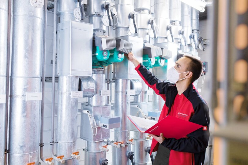 Technician checks pump system