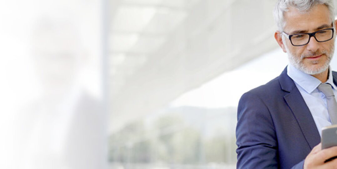 Man looks at smartphone